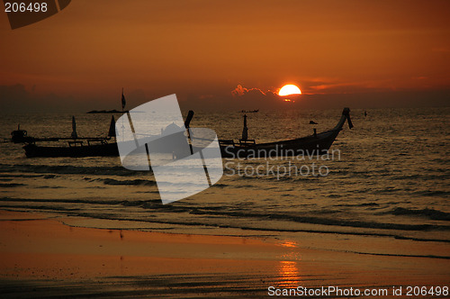 Image of Sunset and tailboats