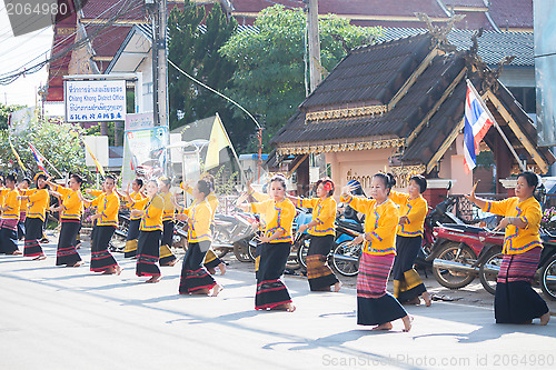Image of Artists in traditional northern of Thailand clothes performing f