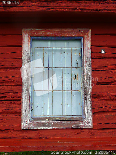 Image of window on red wooden building