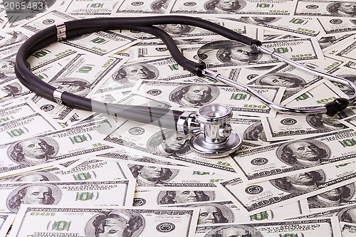 Image of Stethoscope and dollars