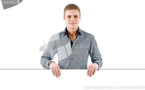 Image of young man with a white poster