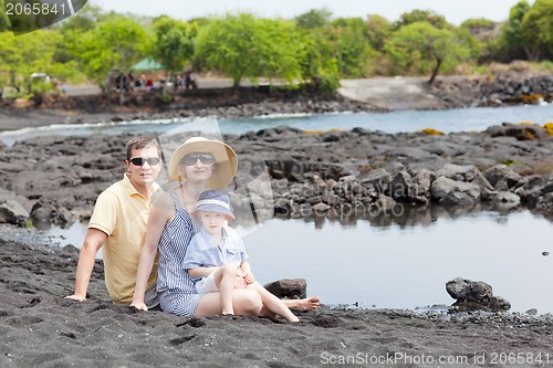 Image of family at the black sand beach
