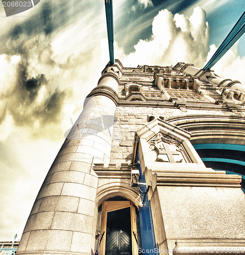 Image of Powerful structure of Tower Bridge in London with clouds in the 