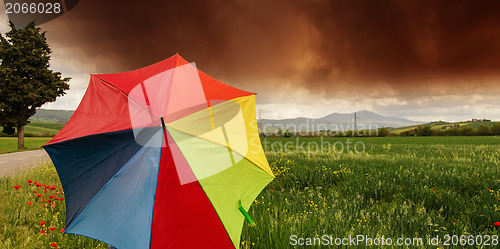 Image of Tuscany Countryside with Storm and colorful Umbrella