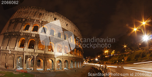 Image of Colosseum at Night, Rome - Wide Angle view with car light trails