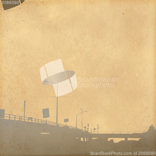 Image of grunge image of cityscape from old paper 