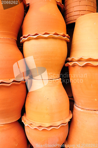 Image of Jardiniere baked clay decorated in the garden 