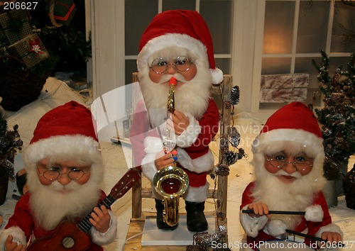 Image of three santas playing