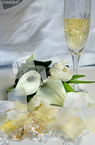 Image of Beautiful wedding bouquet and glass of champagne 