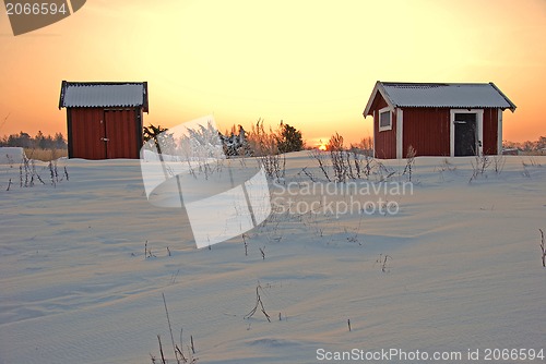 Image of Red cabins in sunrise