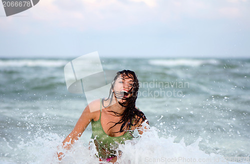 Image of Cheerful wet young woman