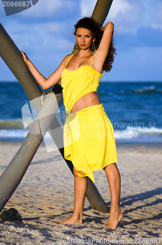 Image of Beautiful young woman in a yellow dress