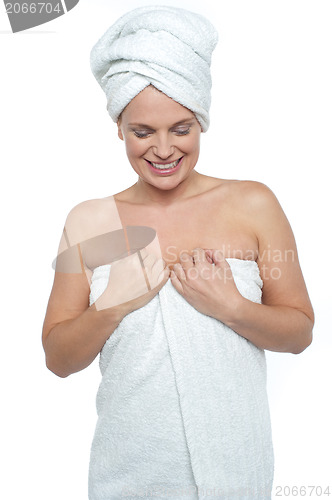 Image of Portrait of charming young lady in bathrobe