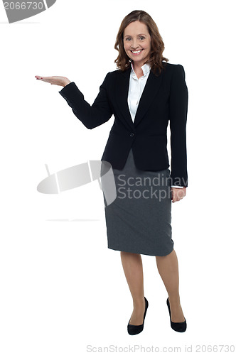 Image of Cheerful executive presenting copy space