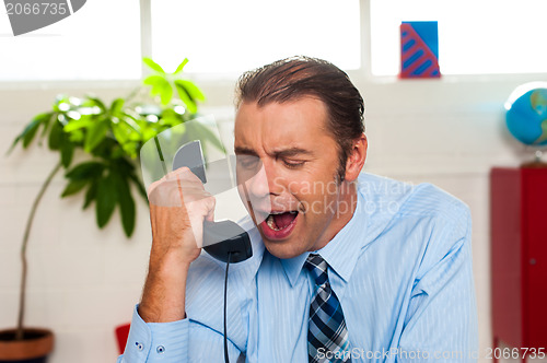 Image of Businessman yelling during the phone call