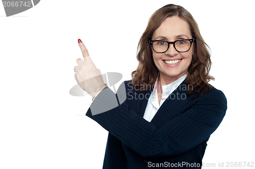 Image of Beautiful executive in suit gesturing copy space