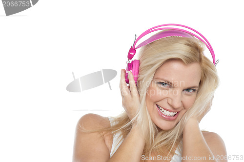 Image of Woman enjoying music with headphones on