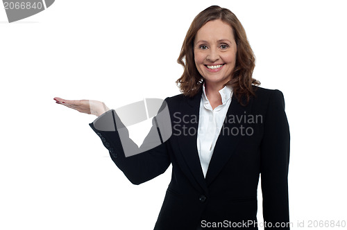 Image of Middle aged corporate woman showing copy space