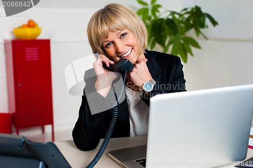 Image of Happy woman enjoying her conversation