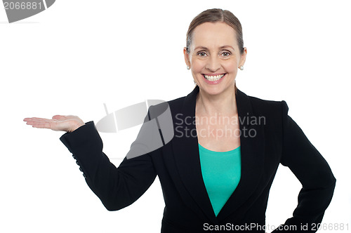 Image of Beautiful woman presenting copy space concept