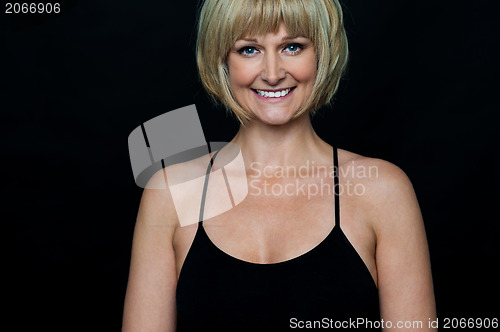 Image of Glamorous woman in sleeveless black spaghetti top