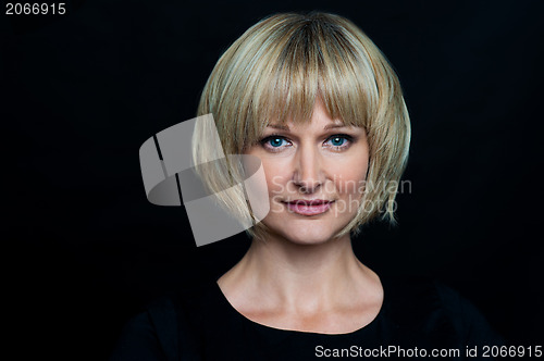 Image of Blonde woman isolated against black background