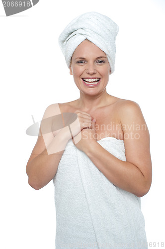 Image of Blonde woman in towel smiling heartily