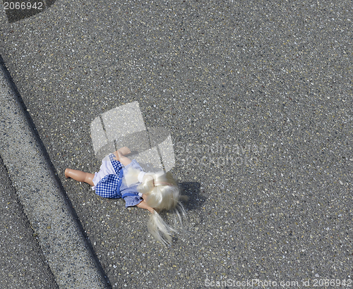 Image of doll on the street
