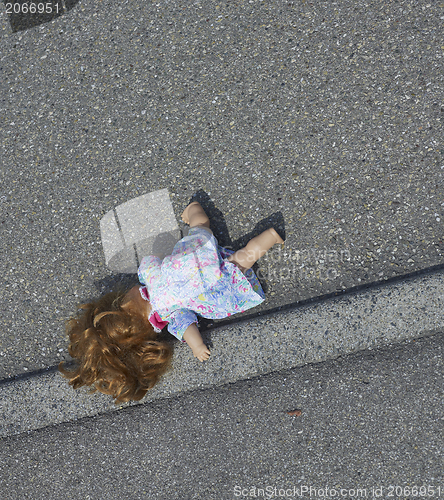 Image of doll on the street