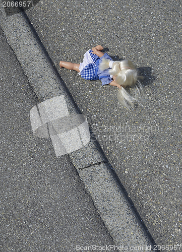 Image of doll on the street