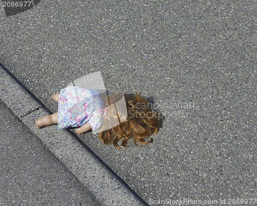 Image of doll on the street