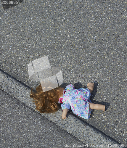 Image of doll on the street