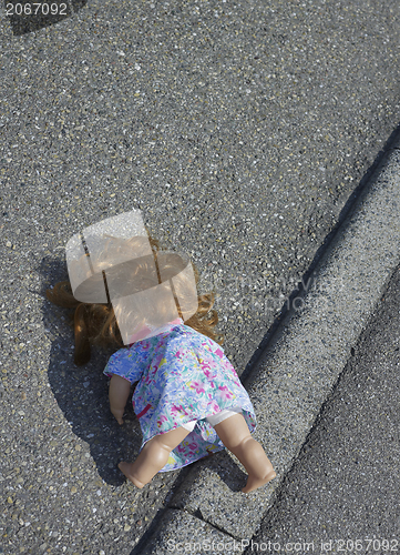 Image of doll on the street