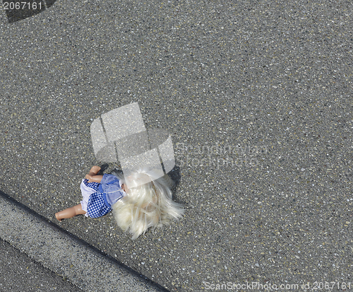 Image of doll on the street