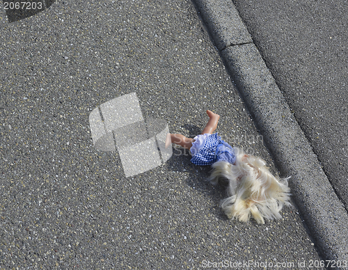 Image of doll on the street