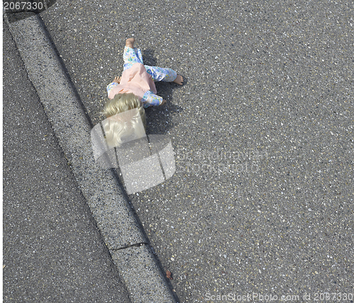 Image of doll on the street