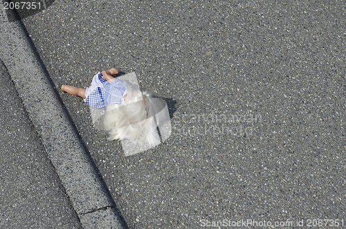 Image of doll on the street