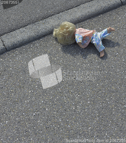 Image of doll on the street