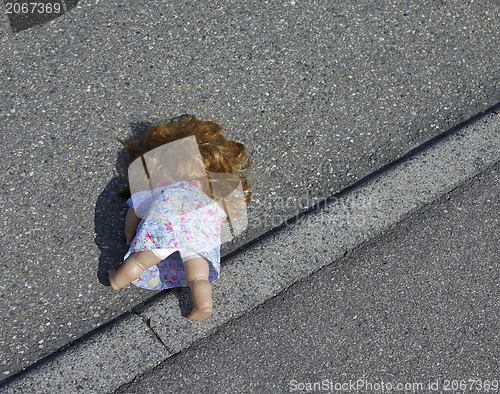 Image of doll on the street