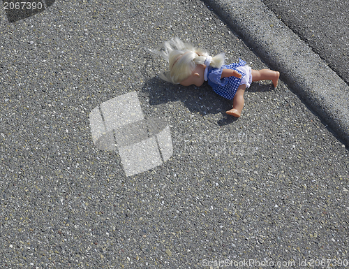 Image of doll on the street