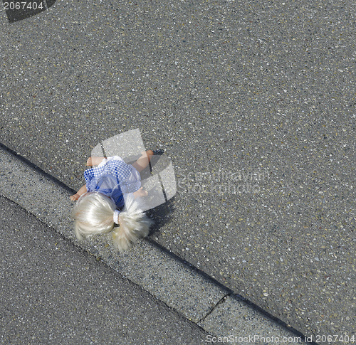 Image of doll on the street