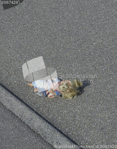 Image of doll on the street