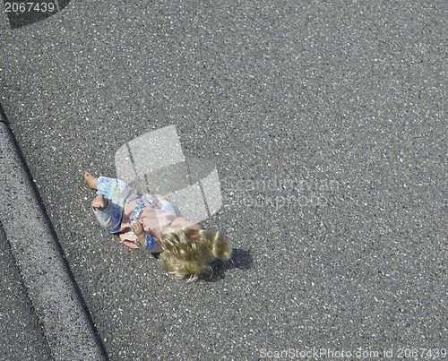 Image of doll on the street