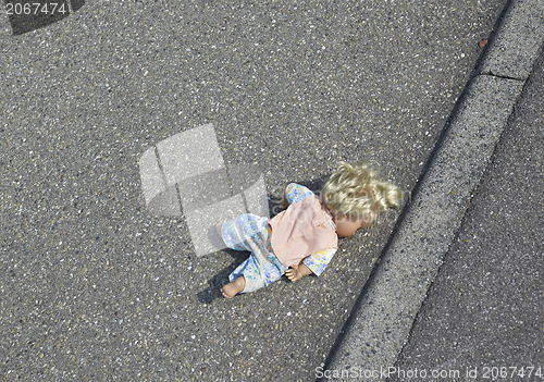 Image of doll on the street