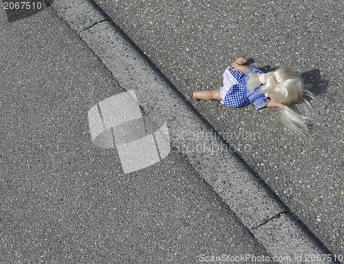 Image of doll on the street