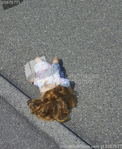 Image of doll on the street