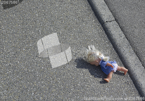 Image of doll on the street