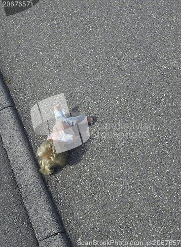 Image of doll on the street