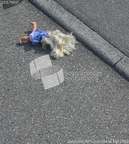 Image of doll on the street