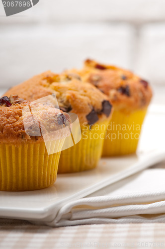 Image of fresh chocolate and raisins muffins